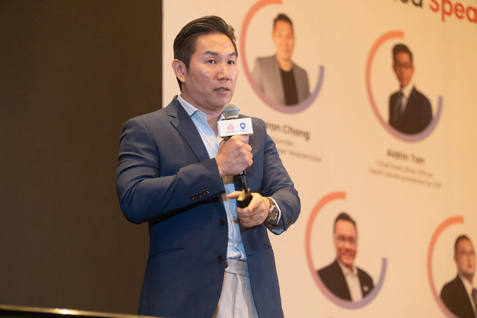 Aaron Chong speaking at the PropertyGuru Agent Summit 2025, with the speaker line-up on screen